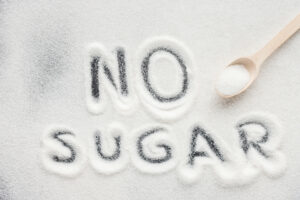 Sugar spelled in small mound of sugar